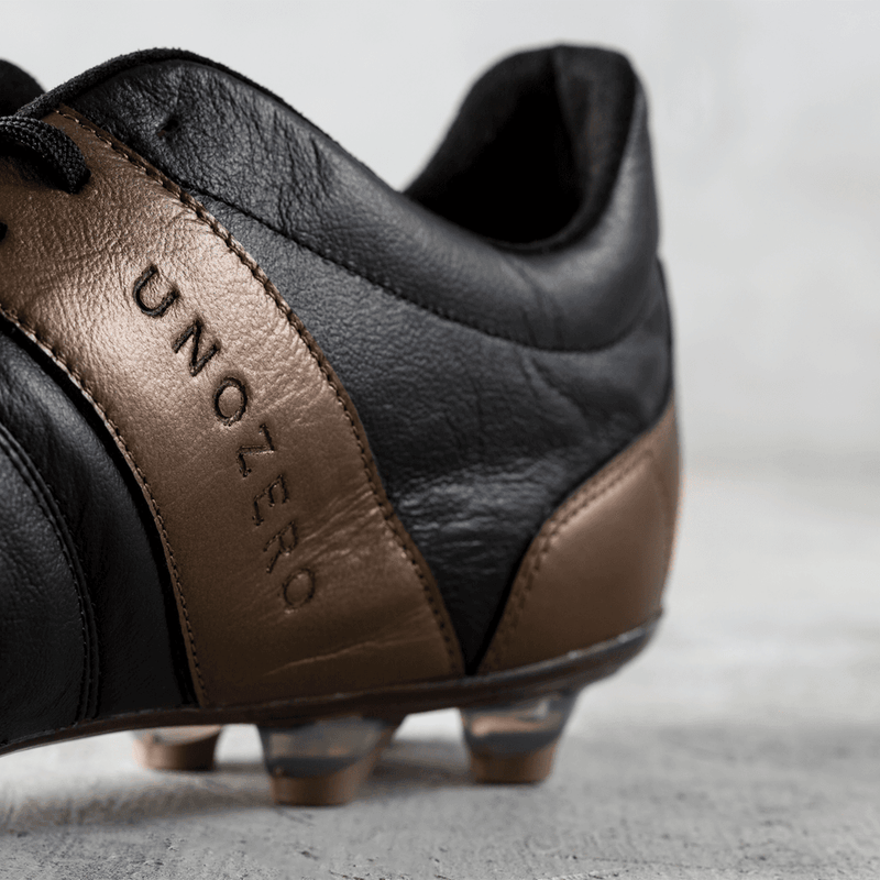 Load image into Gallery viewer, Unozero Modelo 1.0 Firm Ground Soccer Cleats Black Gold

