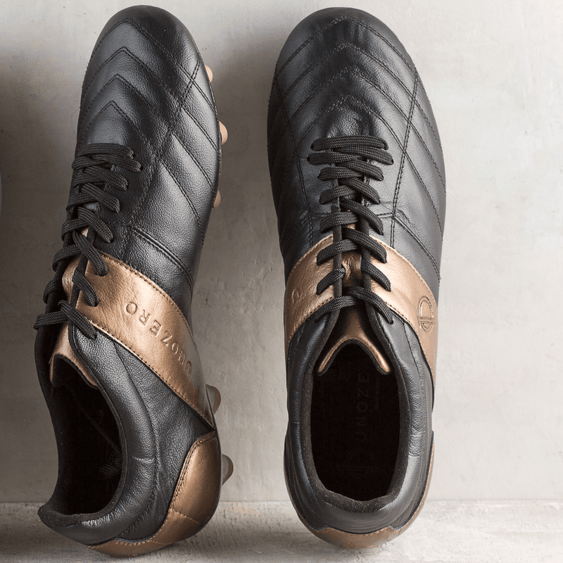 Load image into Gallery viewer, Unozero Modelo 1.0 Firm Ground Soccer Cleats Black Gold

